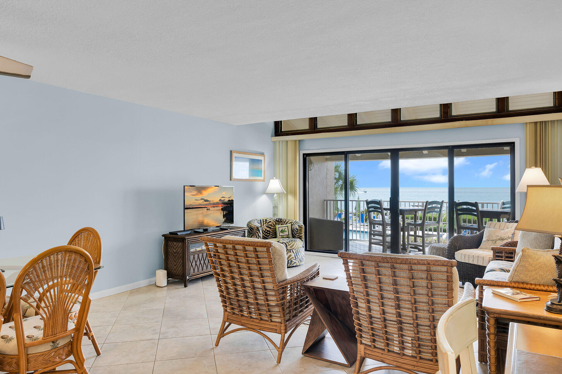 1133 West Ocean Drive, Unit 6 Key Colony Beach, FL 33051 - Photo 28 of 73 a living room with furniture and a floor to ceiling window