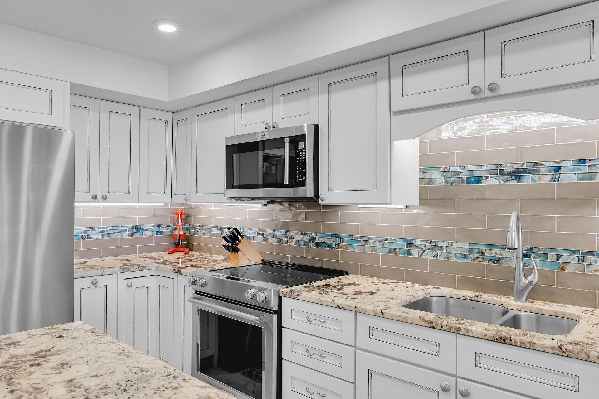 1133 West Ocean Drive, Unit 6 Key Colony Beach, FL 33051 - Photo 36 of 73 a kitchen with a sink stove and microwave