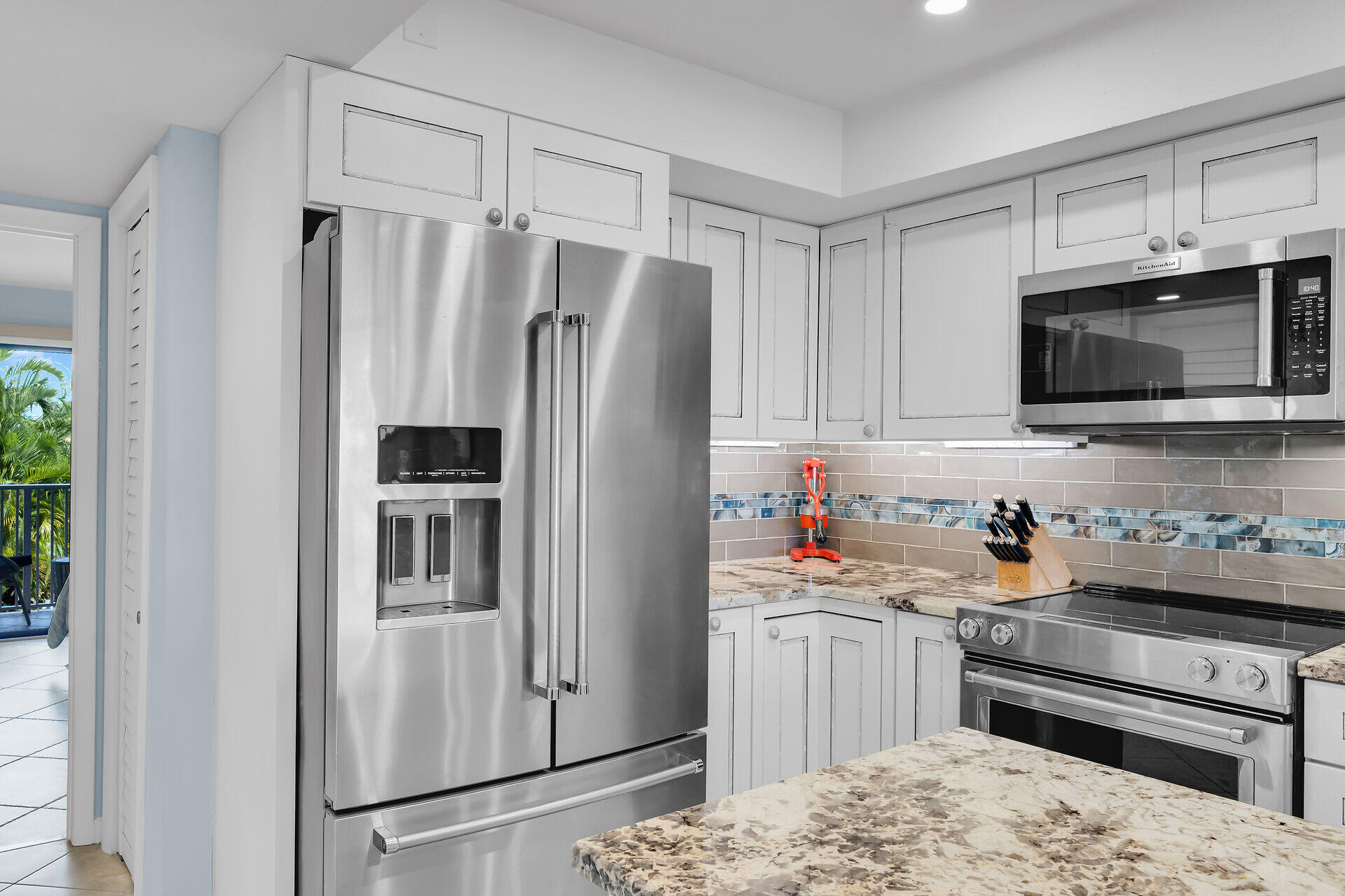 1133 West Ocean Drive, Unit 6 Key Colony Beach, FL 33051 - Photo 37 of 73 a kitchen with stainless steel appliances a refrigerator sink and microwave