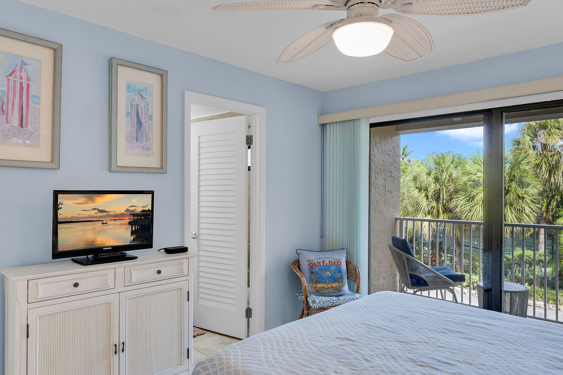 1133 West Ocean Drive, Unit 6 Key Colony Beach, FL 33051 - Photo 40 of 73 a bedroom with a bed and a flat screen tv