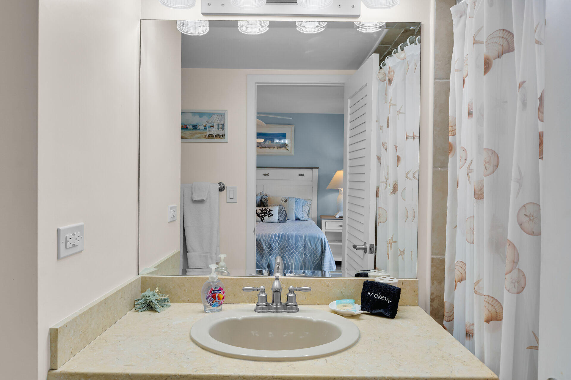 1133 West Ocean Drive, Unit 6 Key Colony Beach, FL 33051 - Photo 42 of 73 a bathroom with a sink and a mirror