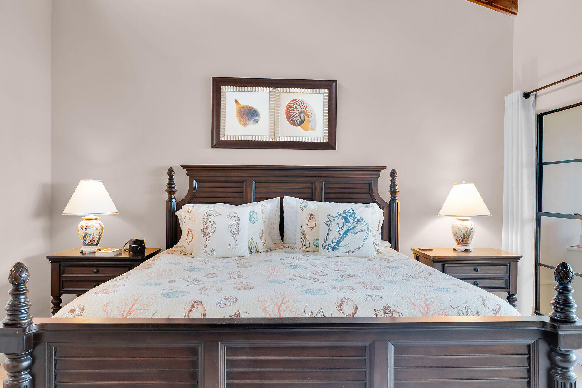 1133 West Ocean Drive, Unit 6 Key Colony Beach, FL 33051 - Photo 52 of 73 a bed sitting in a bedroom and lamp