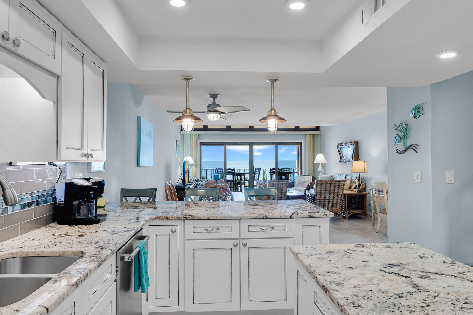1133 West Ocean Drive, Unit 6 Key Colony Beach, FL 33051 - Photo 6 of 73 a kitchen with granite countertop a sink stove and cabinets