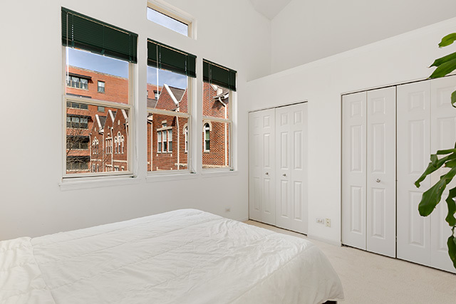 5226 South Berkeley Avenue Chicago, IL 60615 - Photo 11 of 28 a bedroom with a bed and a window