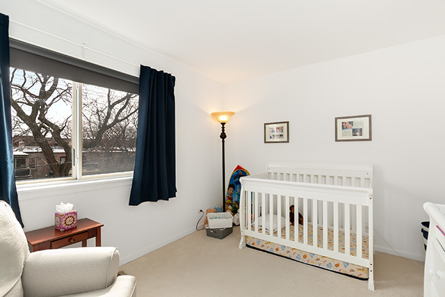 5226 South Berkeley Avenue Chicago, IL 60615 - Photo 13 of 28 a bedroom with furniture and windows