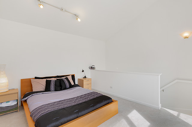 5226 South Berkeley Avenue Chicago, IL 60615 - Photo 18 of 28 a bedroom with a bed and window