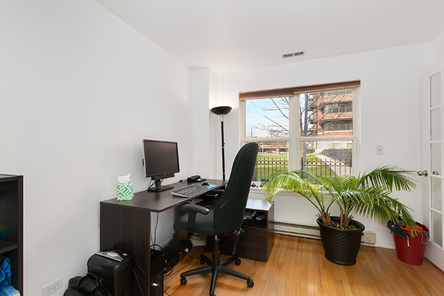 5226 South Berkeley Avenue Chicago, IL 60615 - Photo 20 of 28 a view of a workspace with furniture and a window