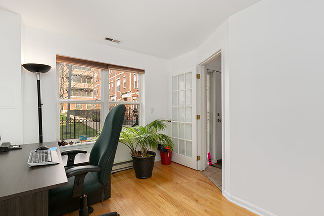 5226 South Berkeley Avenue Chicago, IL 60615 - Photo 21 of 28 a view of a workspace with furniture and a window