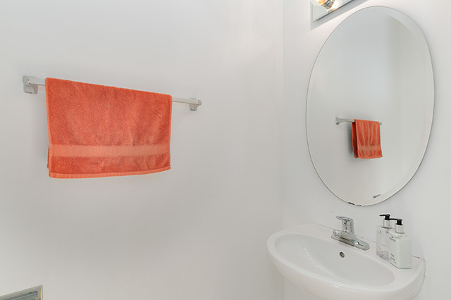 5226 South Berkeley Avenue Chicago, IL 60615 - Photo 23 of 28 a bathroom with a sink and a mirror