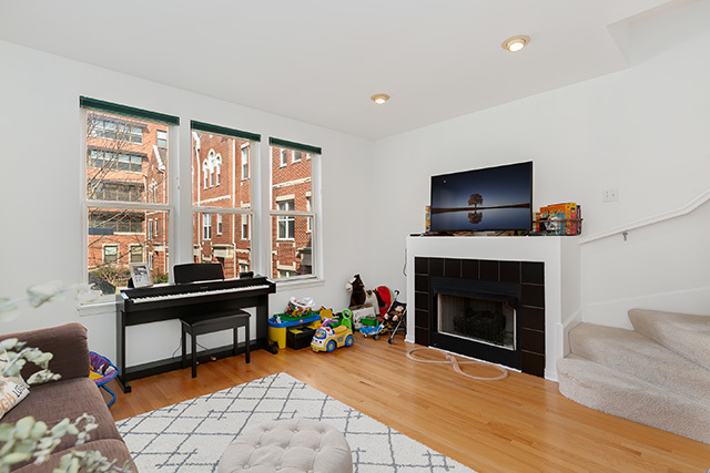 5226 South Berkeley Avenue Chicago, IL 60615 - Photo 4 of 28 a livingroom with fireplace dining space and a flat screen tv