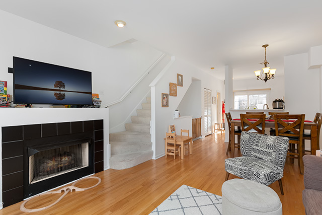 5226 South Berkeley Avenue Chicago, IL 60615 - Photo 5 of 28 a living room with furniture a dining table and a fireplace