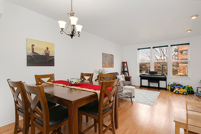 5226 South Berkeley Avenue Chicago, IL 60615 - Photo 6 of 28 a view of a dining room with furniture window and wooden floor