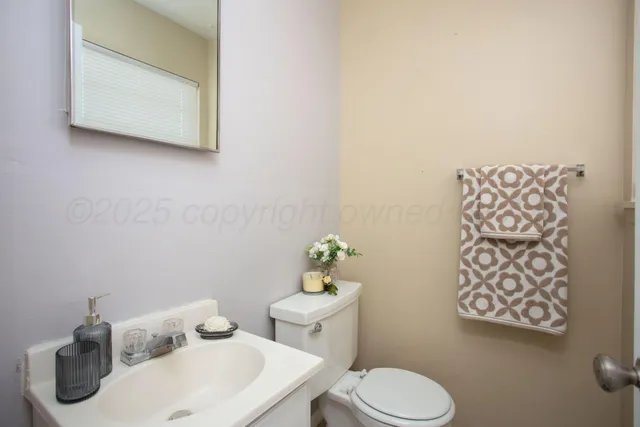 an empty room with a ceiling fan and a window