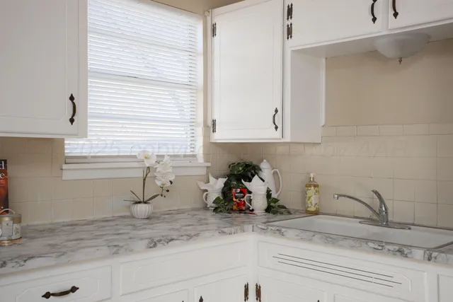 a kitchen with stainless steel appliances a refrigerator sink and stove