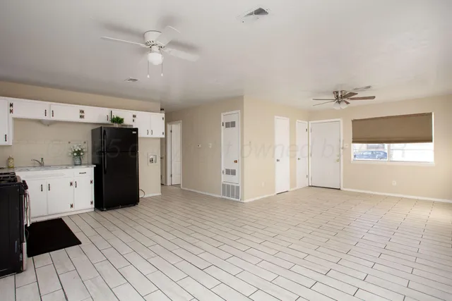 a kitchen with a sink and cabinets