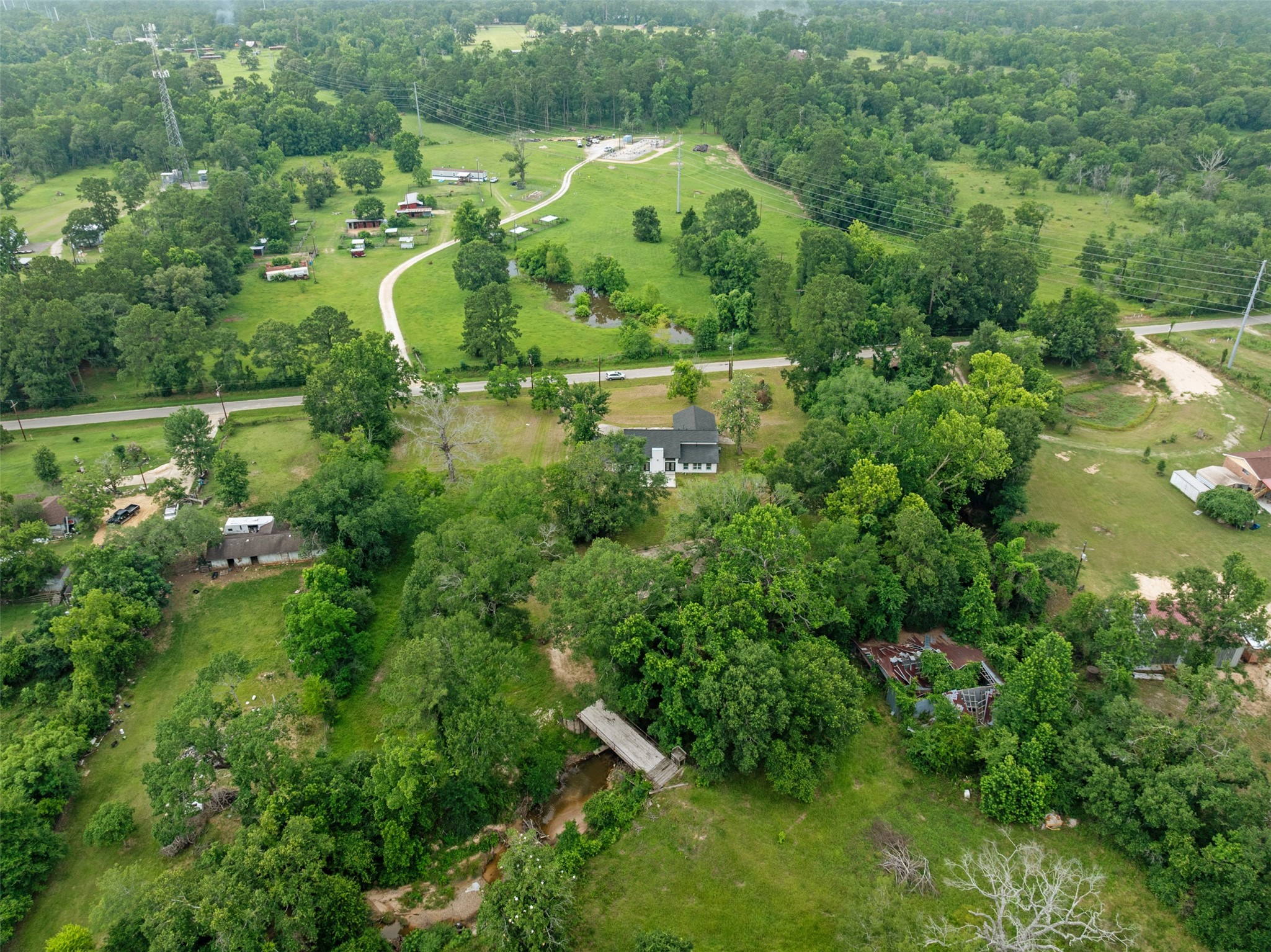10308 Ehlers Road Conroe, TX 77302 - Photo 2 of 33 an aerial view of a house with a yard and lake view