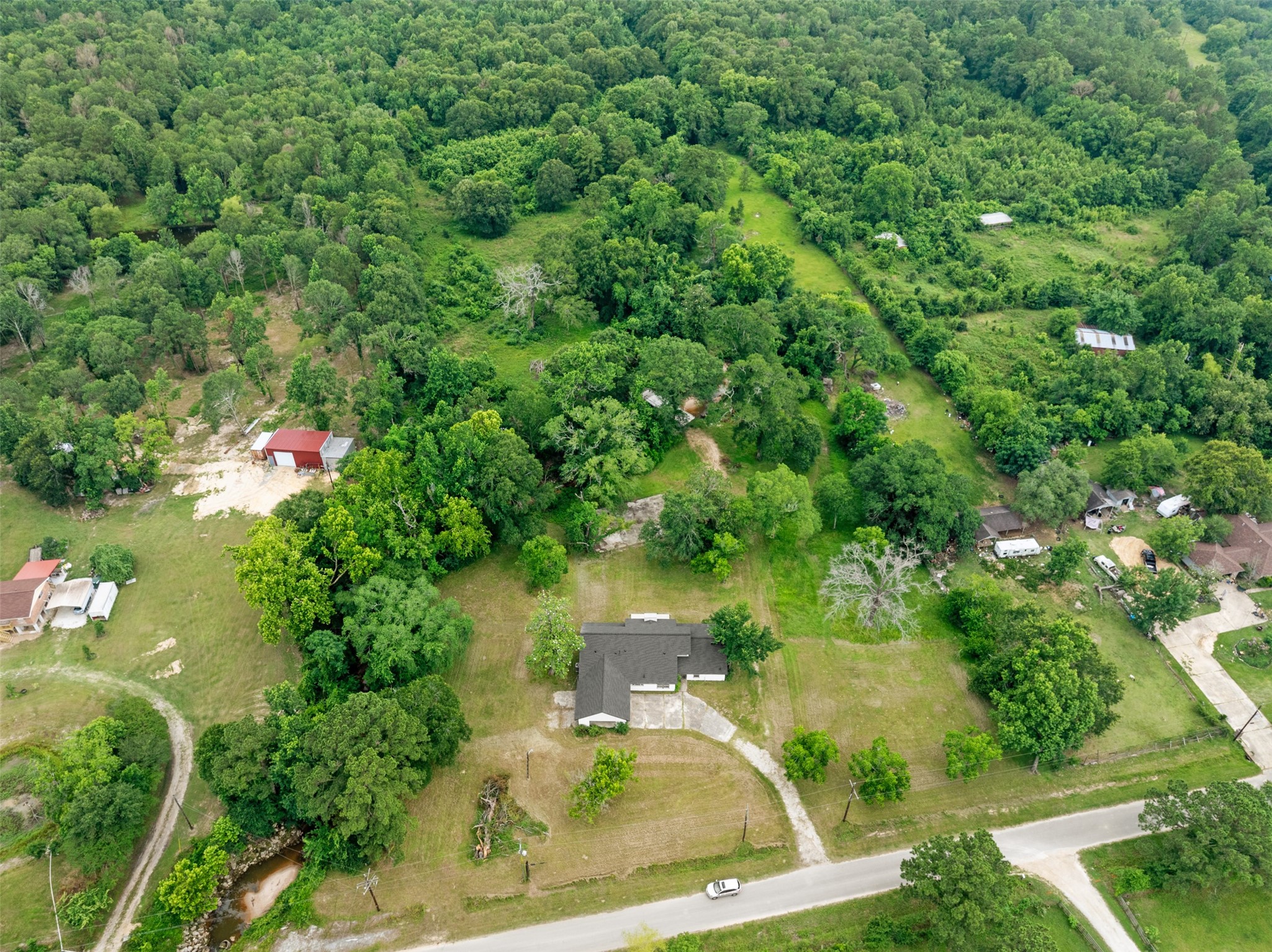 10308 Ehlers Road Conroe, TX 77302 - Photo 30 of 33 an aerial view of residential house with outdoor space and trees all around
