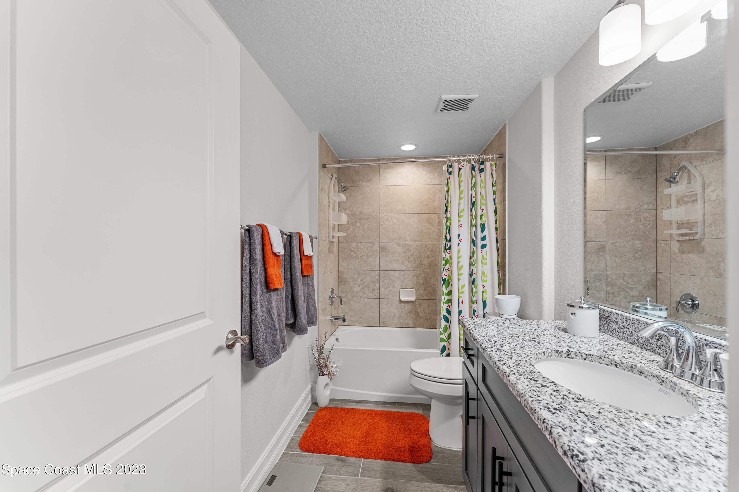 1825 Riverside Drive, Unit 305S Titusville, FL 32780 - Photo 14 of 34 a bathroom with a tub sink and mirror