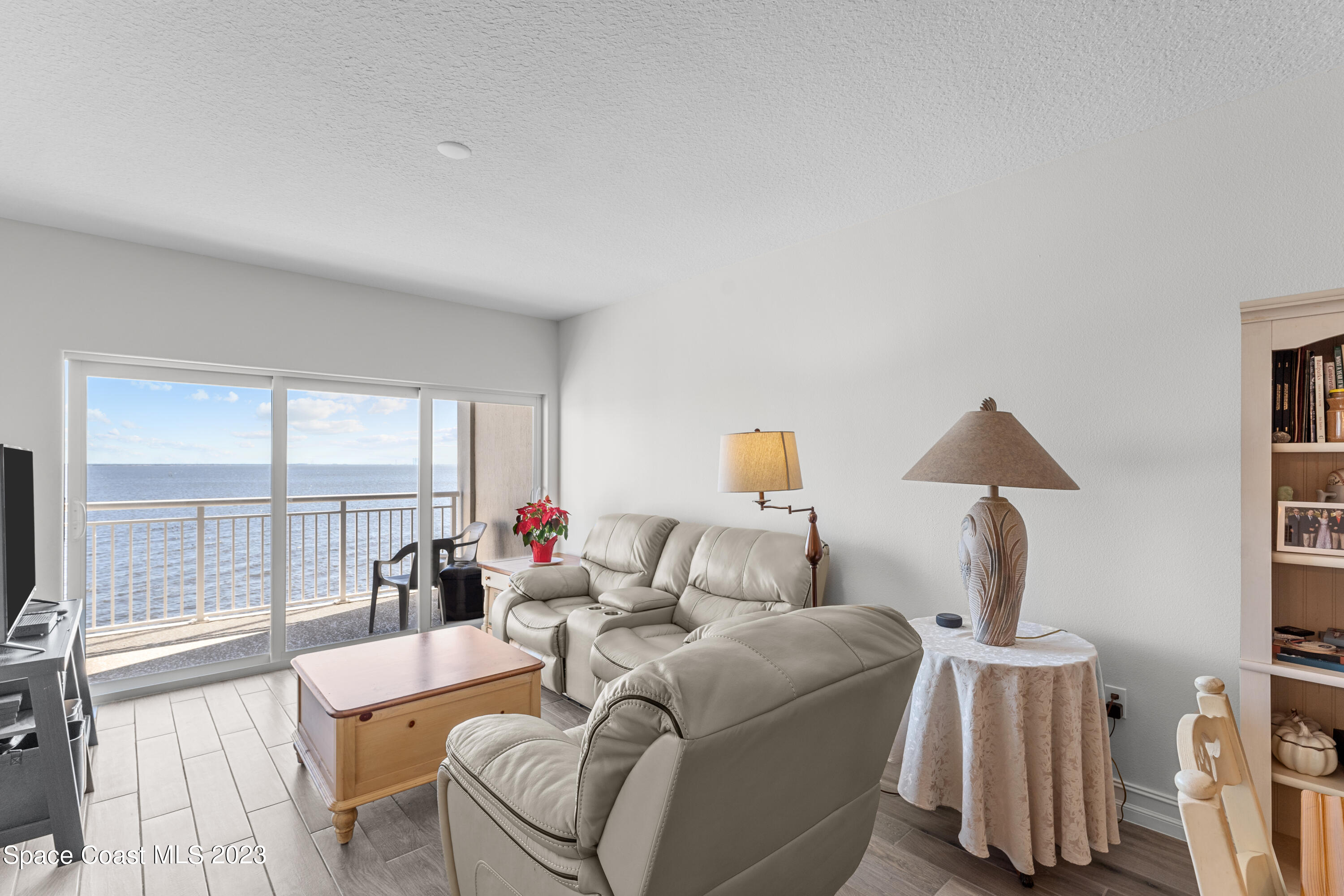 1825 Riverside Drive, Unit 305S Titusville, FL 32780 - Photo 22 of 34 a living room with furniture and a large window
