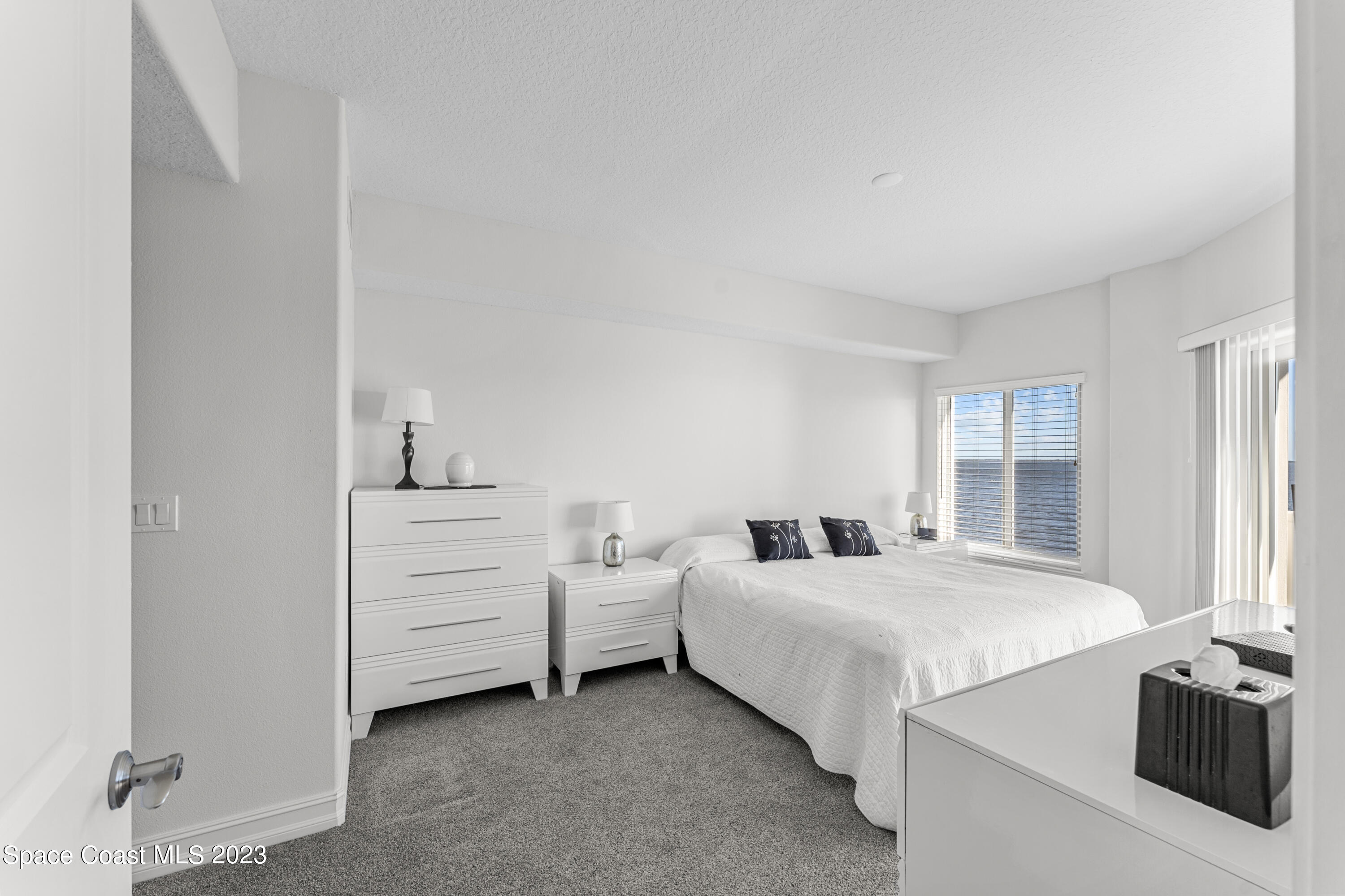 1825 Riverside Drive, Unit 305S Titusville, FL 32780 - Photo 23 of 34 a room with bed and window