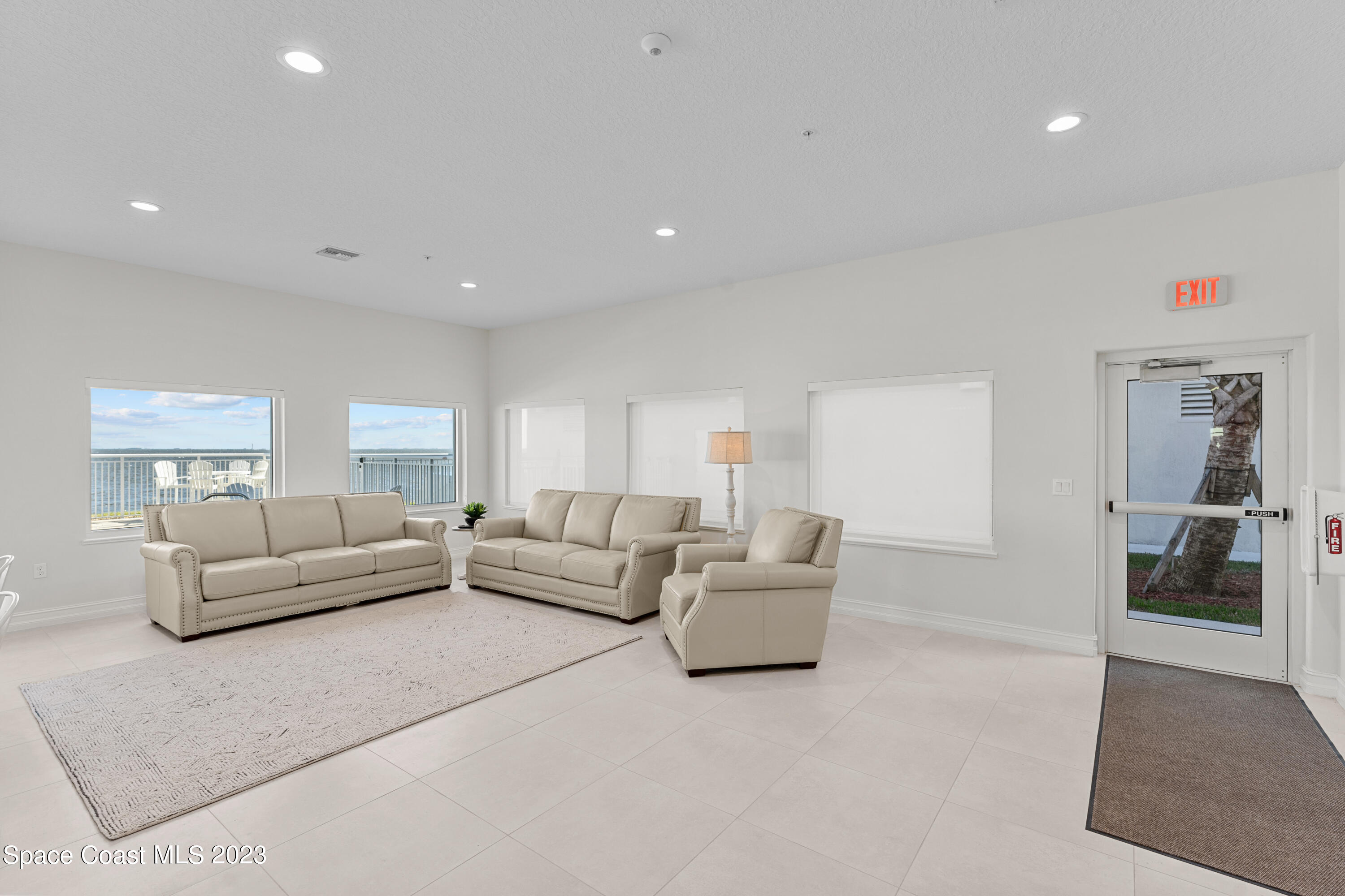 1825 Riverside Drive, Unit 305S Titusville, FL 32780 - Photo 32 of 34 a living room with furniture and a couch