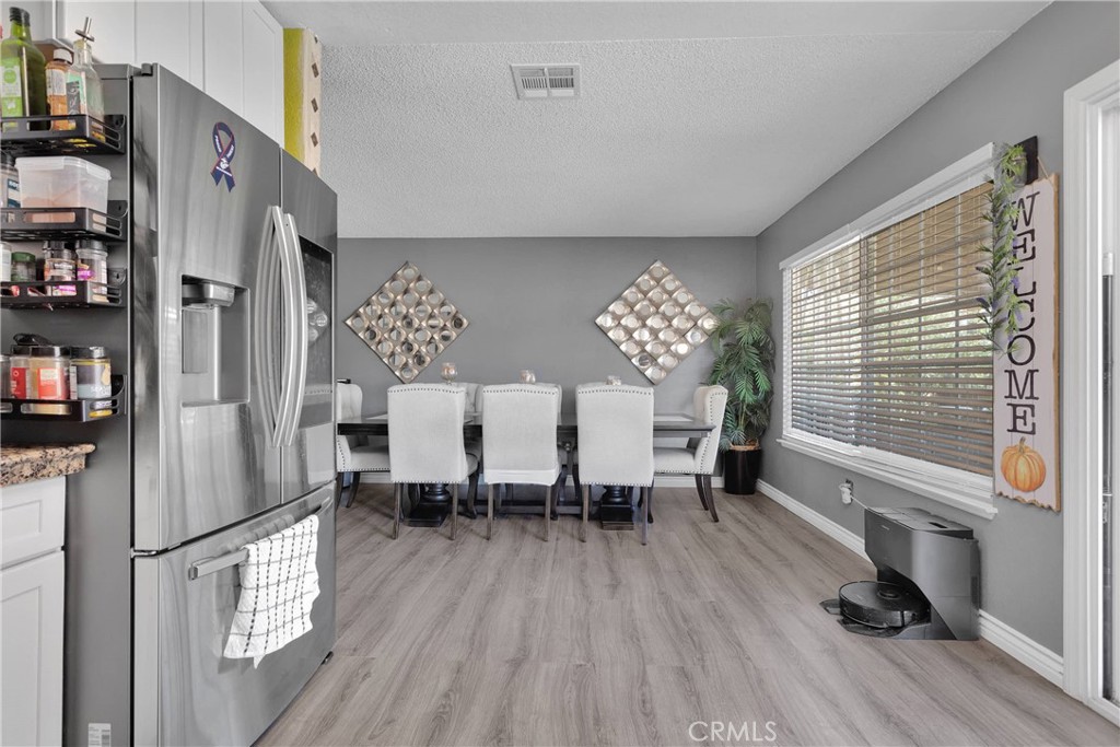 14111 Liberty Way Victorville, CA 92392 - Photo 16 of 39 a living room with furniture and a wooden floor
