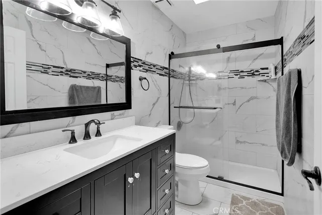 a bedroom with a bed and furniture