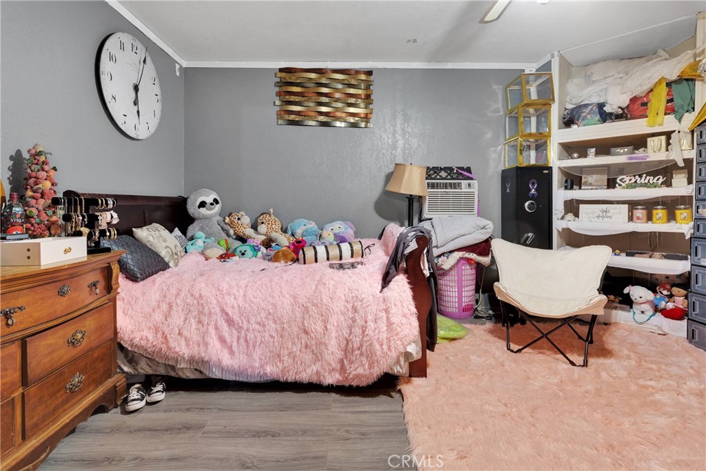 14111 Liberty Way Victorville, CA 92392 - Photo 26 of 39 a bedroom with a bed and furniture