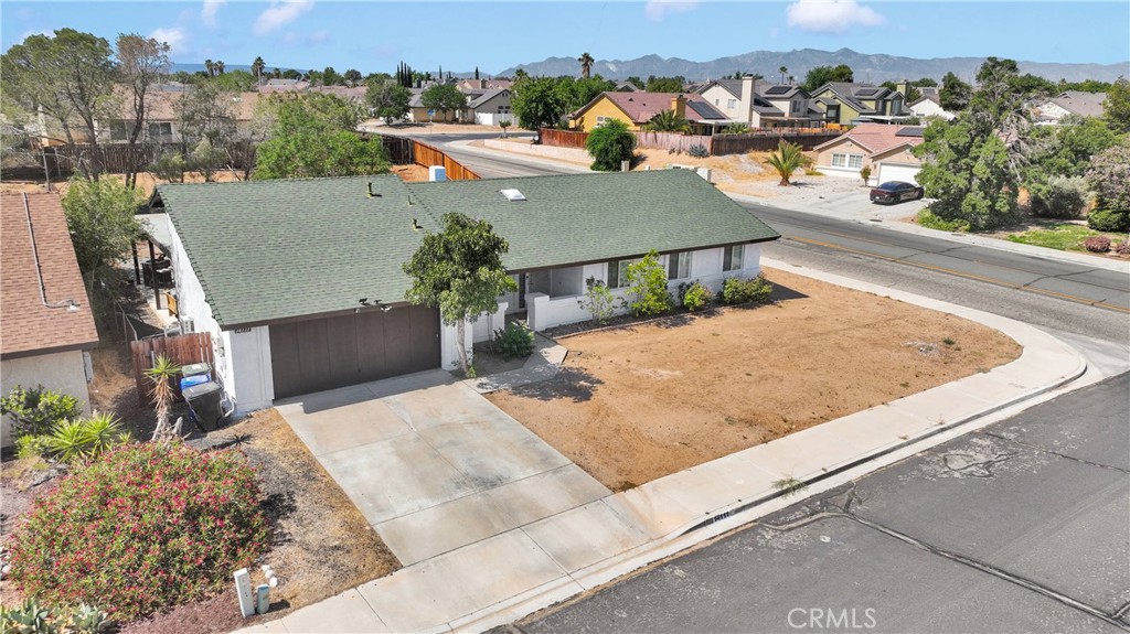 14111 Liberty Way Victorville, CA 92392 - Photo 32 of 39 an aerial view of a house with a yard and large tree
