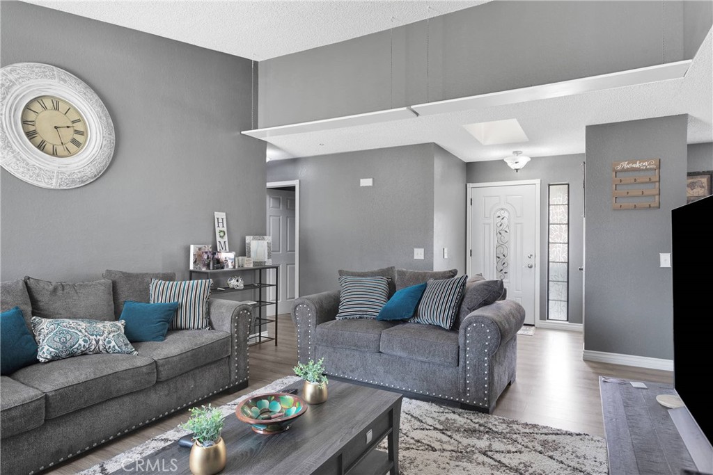 14111 Liberty Way Victorville, CA 92392 - Photo 9 of 39 a living room with furniture and a wooden floor