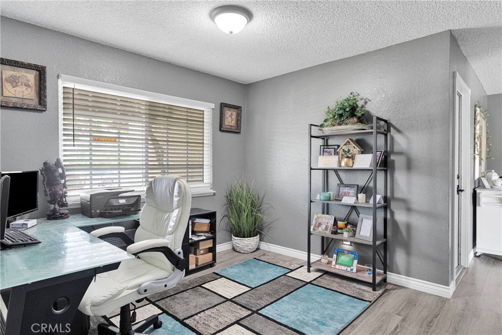 14111 Liberty Way Victorville, CA 92392 - Photo 10 of 39 a view of a workspace with furniture and a window