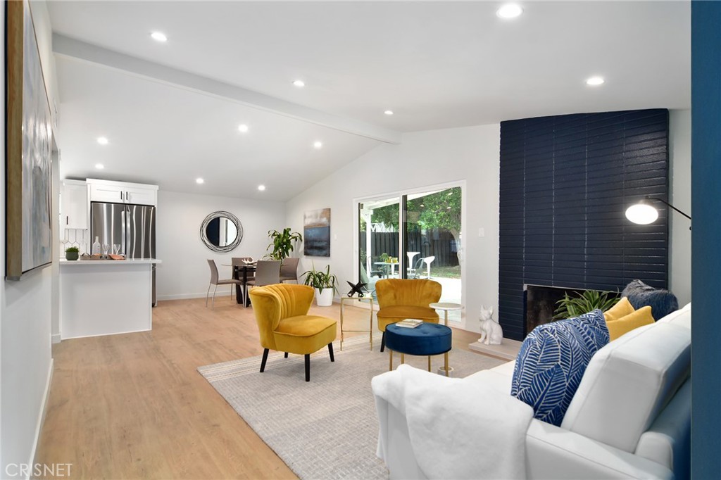 20608 Haynes Street Winnetka, CA 91306 - Photo 3 of 25 a living room with furniture and a large window