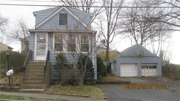 16 Plant Road Waltham, MA 02451 - Photo 1 of 18 a front view of a house with a yard