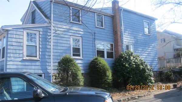 16 Plant Road Waltham, MA 02451 - Photo 3 of 18 a view of a brick house with a yard
