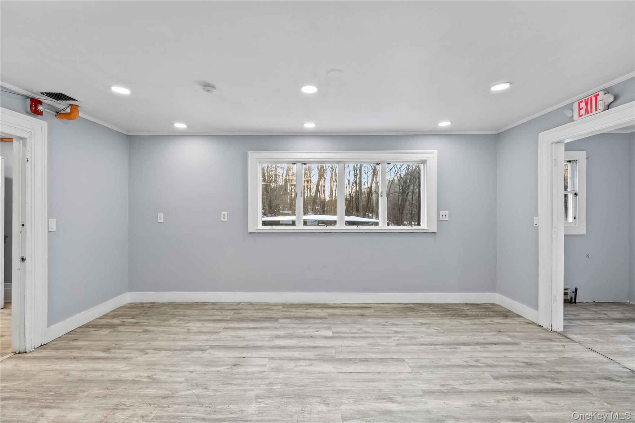 996 Haverstraw Road Suffern, NY 10901 - Photo 13 of 50 a view of empty room with wooden floor and fan
