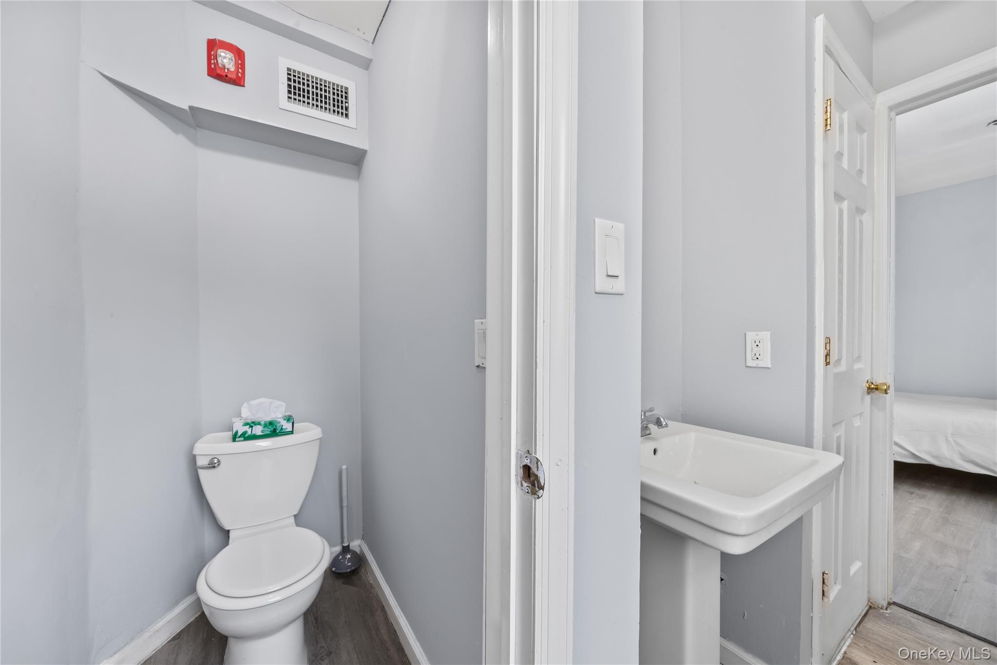 996 Haverstraw Road Suffern, NY 10901 - Photo 17 of 50 a bathroom with a sink a toilet and a view of bathroom