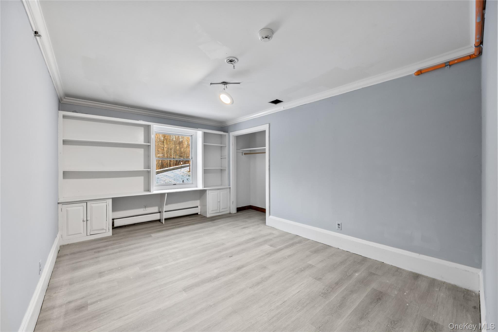 996 Haverstraw Road Suffern, NY 10901 - Photo 23 of 50 an empty room with cabinet and mirrors