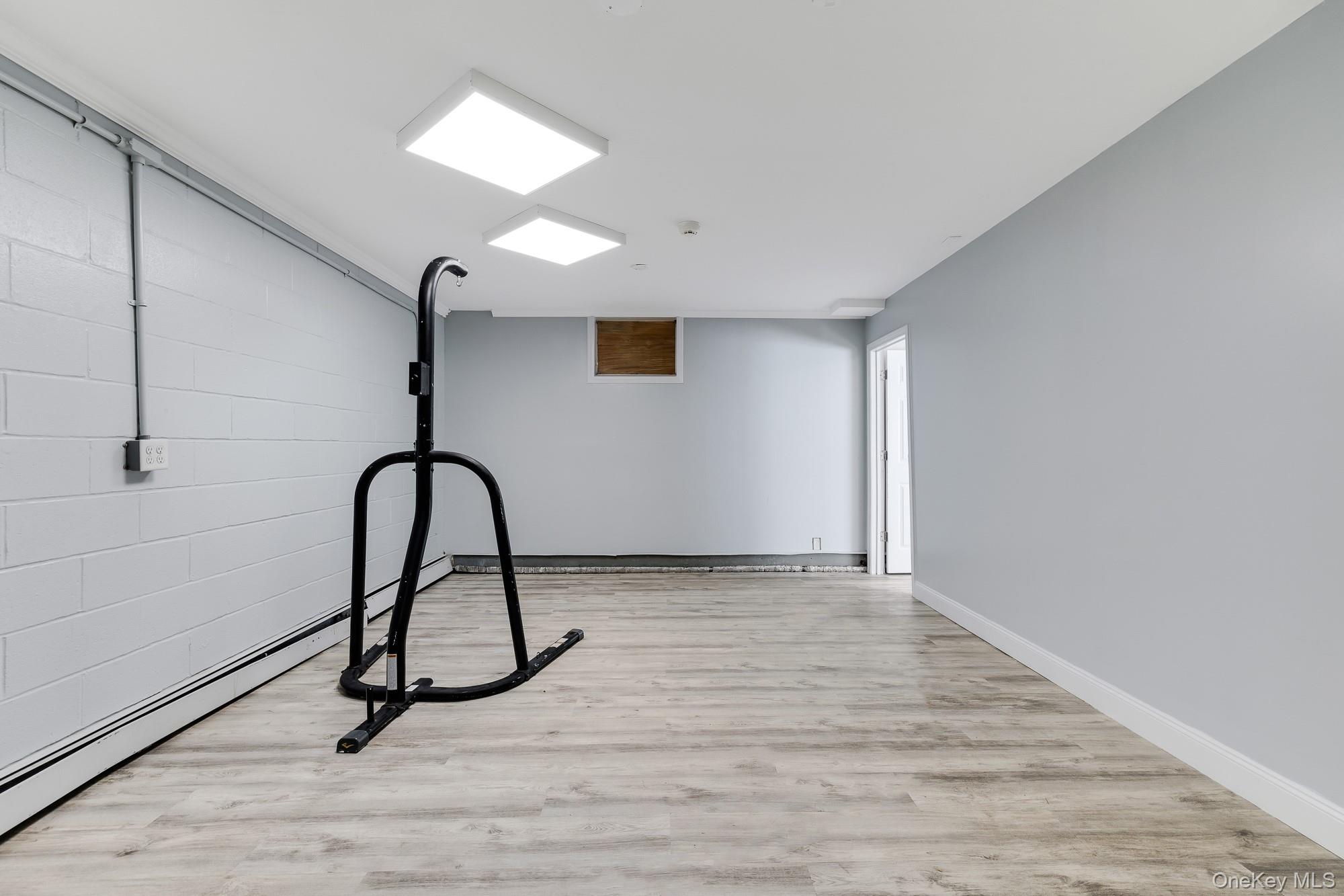 996 Haverstraw Road Suffern, NY 10901 - Photo 31 of 50 a view of a room with a wooden floor and a window