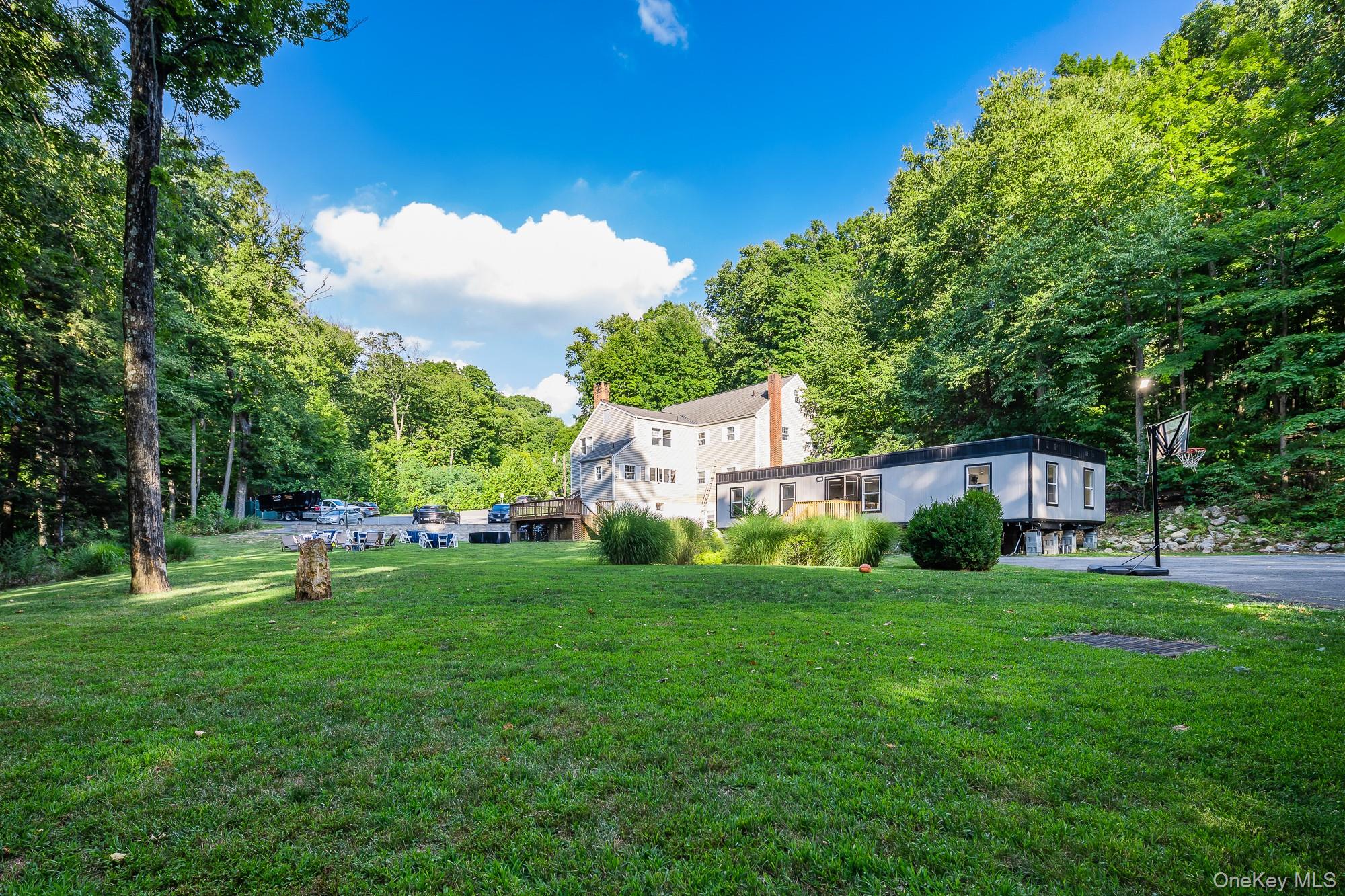 996 Haverstraw Road Suffern, NY 10901 - Photo 38 of 50 a view of a house with a yard and sitting area