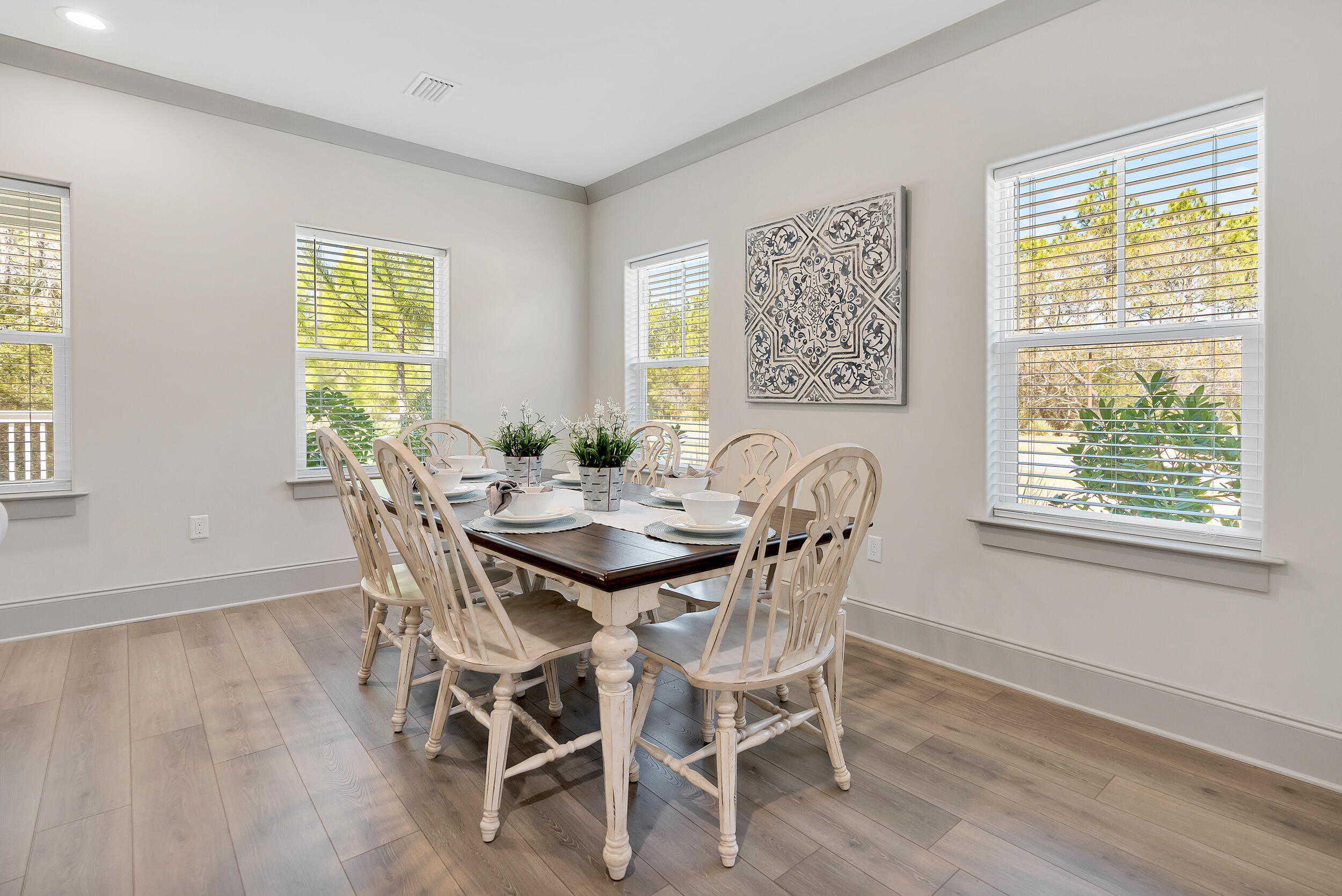 135 Golden Bell Ct Inlet Beach, Unit 135D Inlet Beach, FL 32461 - Photo 15 of 44 a view of a dining room with furniture and wooden floor