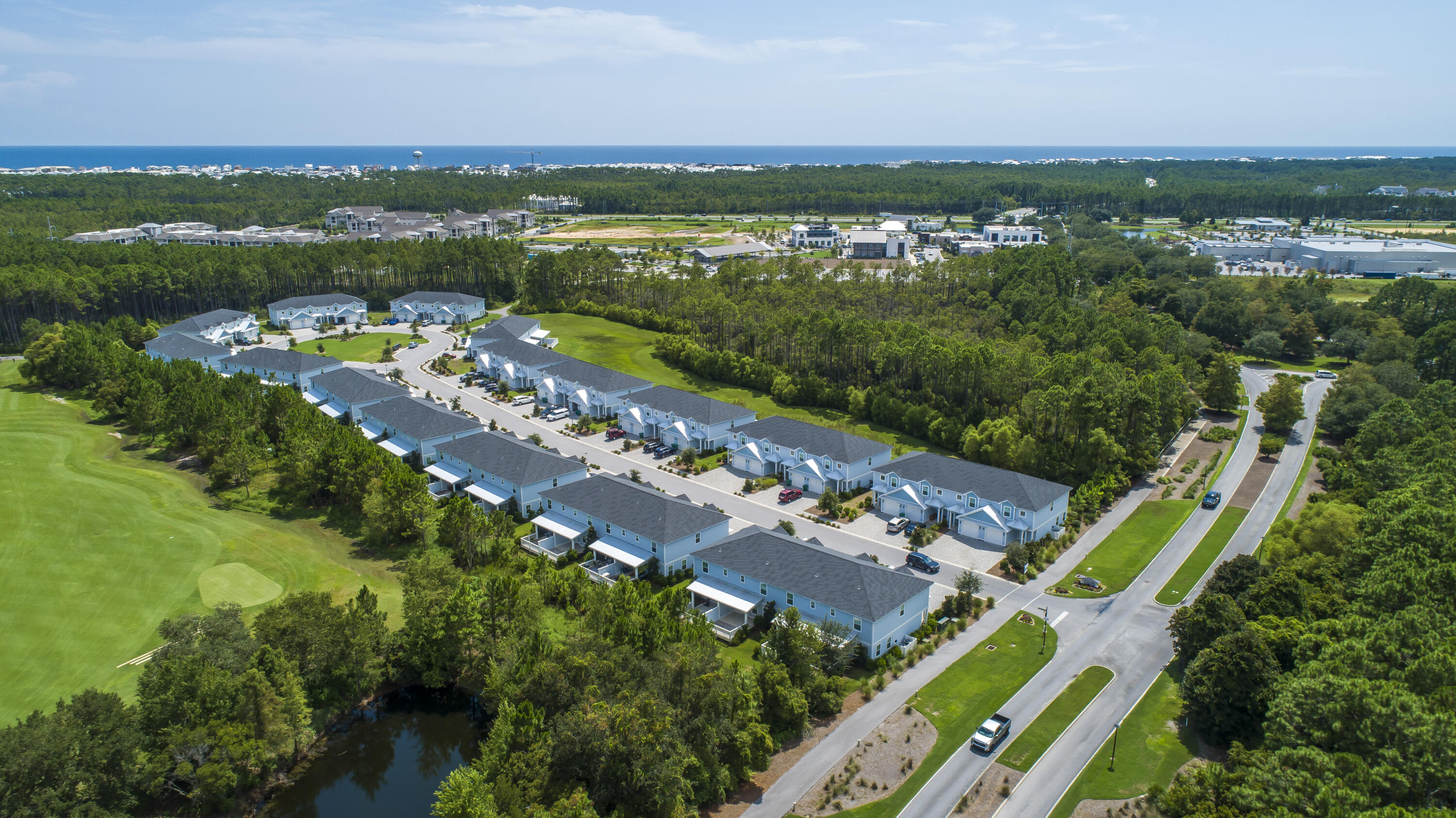 135 Golden Bell Ct Inlet Beach, Unit 135D Inlet Beach, FL 32461 - Photo 34 of 44 an aerial view of a city with lots of residential buildings and mountain view in back