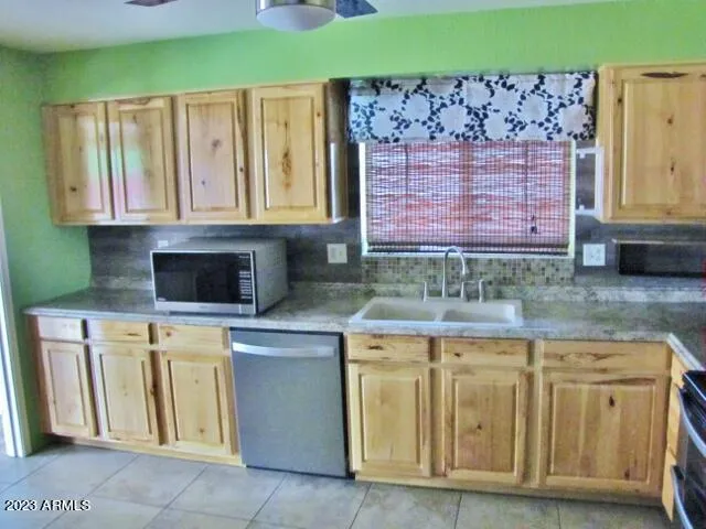 a kitchen with cabinets and window