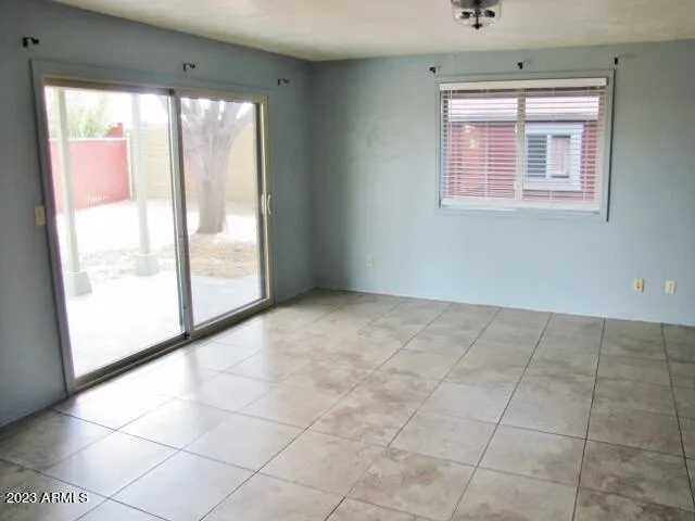 a view of an empty room with a window