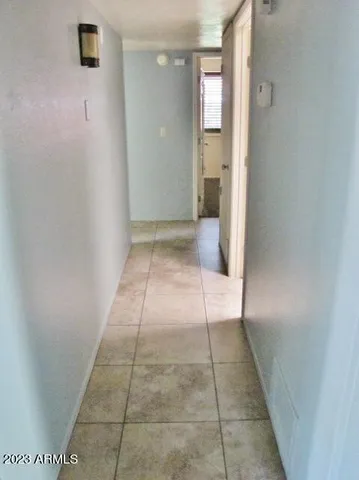 a view of hallway with a shower