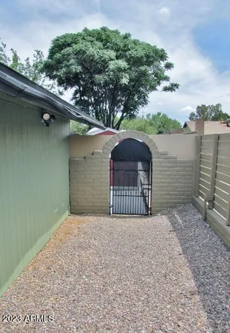 a view of a wooden fence and a floor to ceiling window