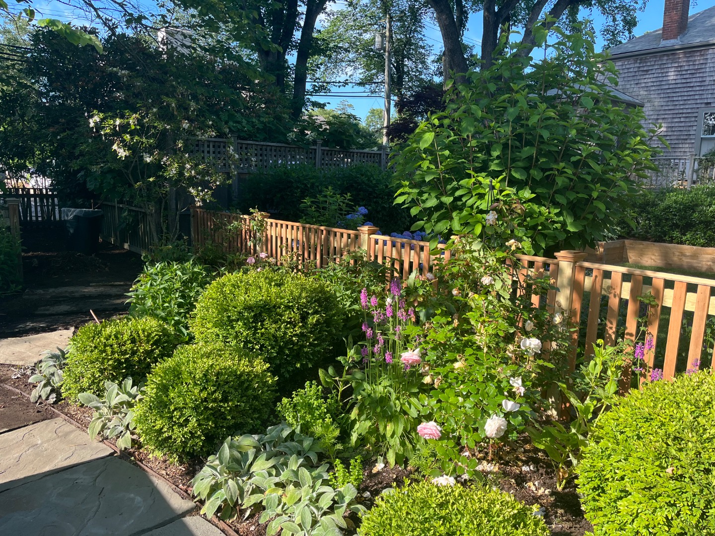 24 Milk Street Nantucket, MA 02554 - Photo 4 of 39 a view of a garden of flowers
