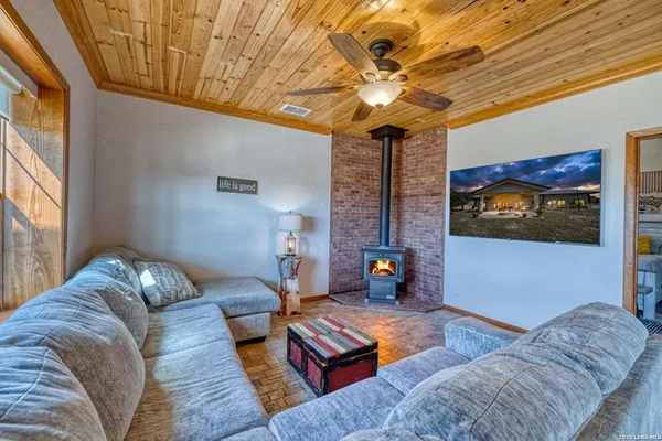 a large bed sitting in a room next to a window