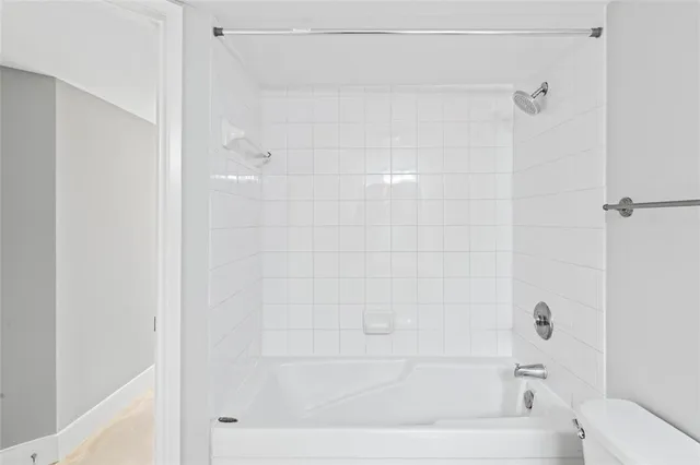 a small space with wooden floor and a window