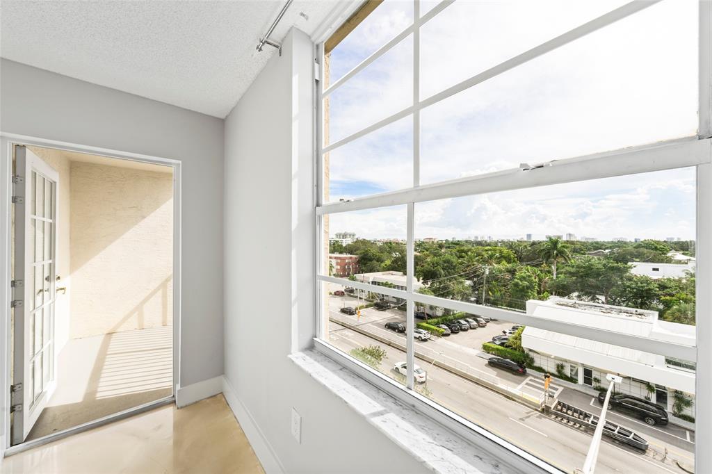 520 Southeast 5th Avenue, Unit 1504 Fort Lauderdale, FL 33301 - Photo 21 of 53 a view of a balcony with wooden floor and iron stairs