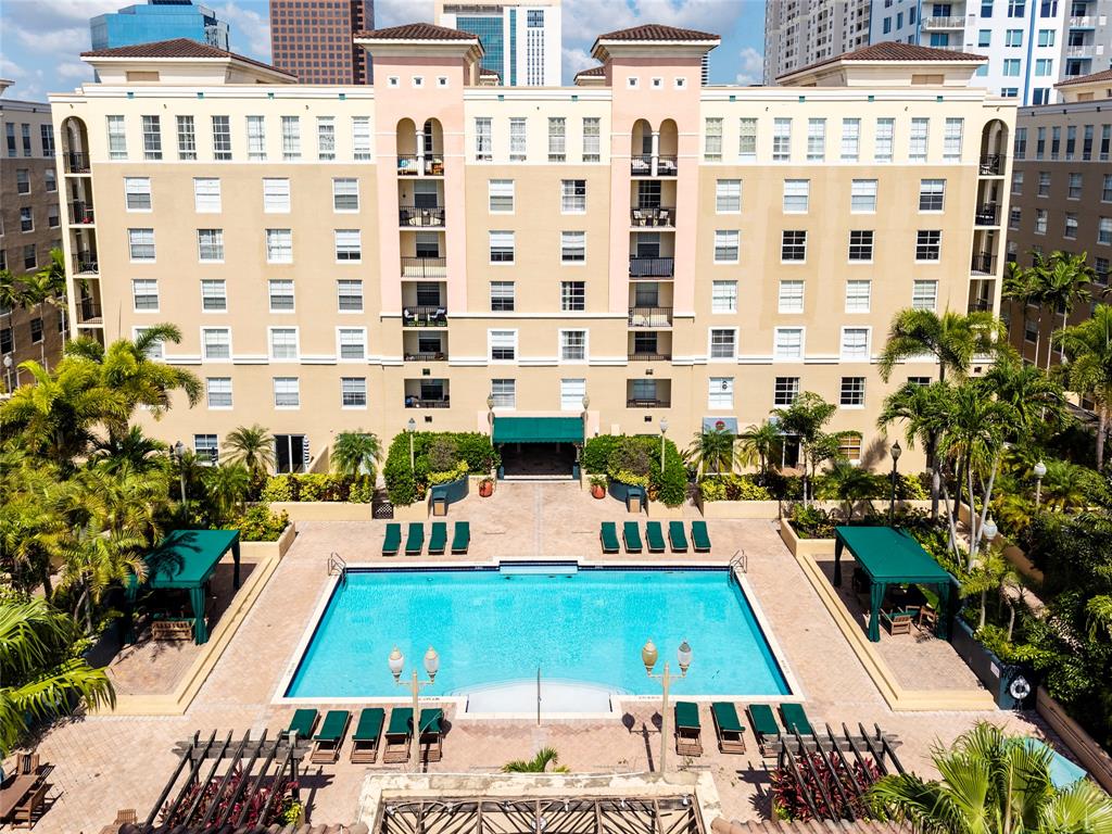 520 Southeast 5th Avenue, Unit 1504 Fort Lauderdale, FL 33301 - Photo 34 of 53 Stunning pool area surrounded by lush landscaping, featuring cabanas, a hot tub, shower, and more for ultimate relaxation.